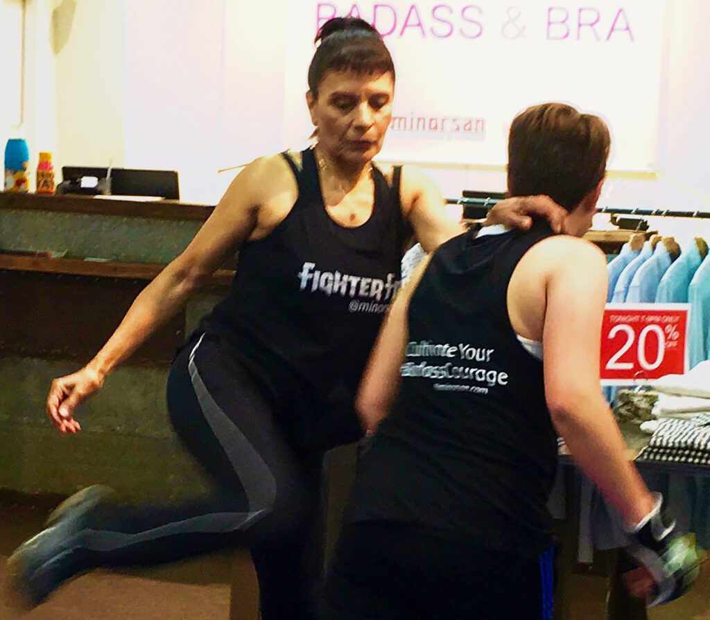 two women demonstrating self-defense