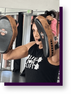 your safety quotieny woman holding focus mitts