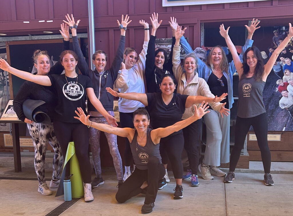 women holding up arms in a happy mood